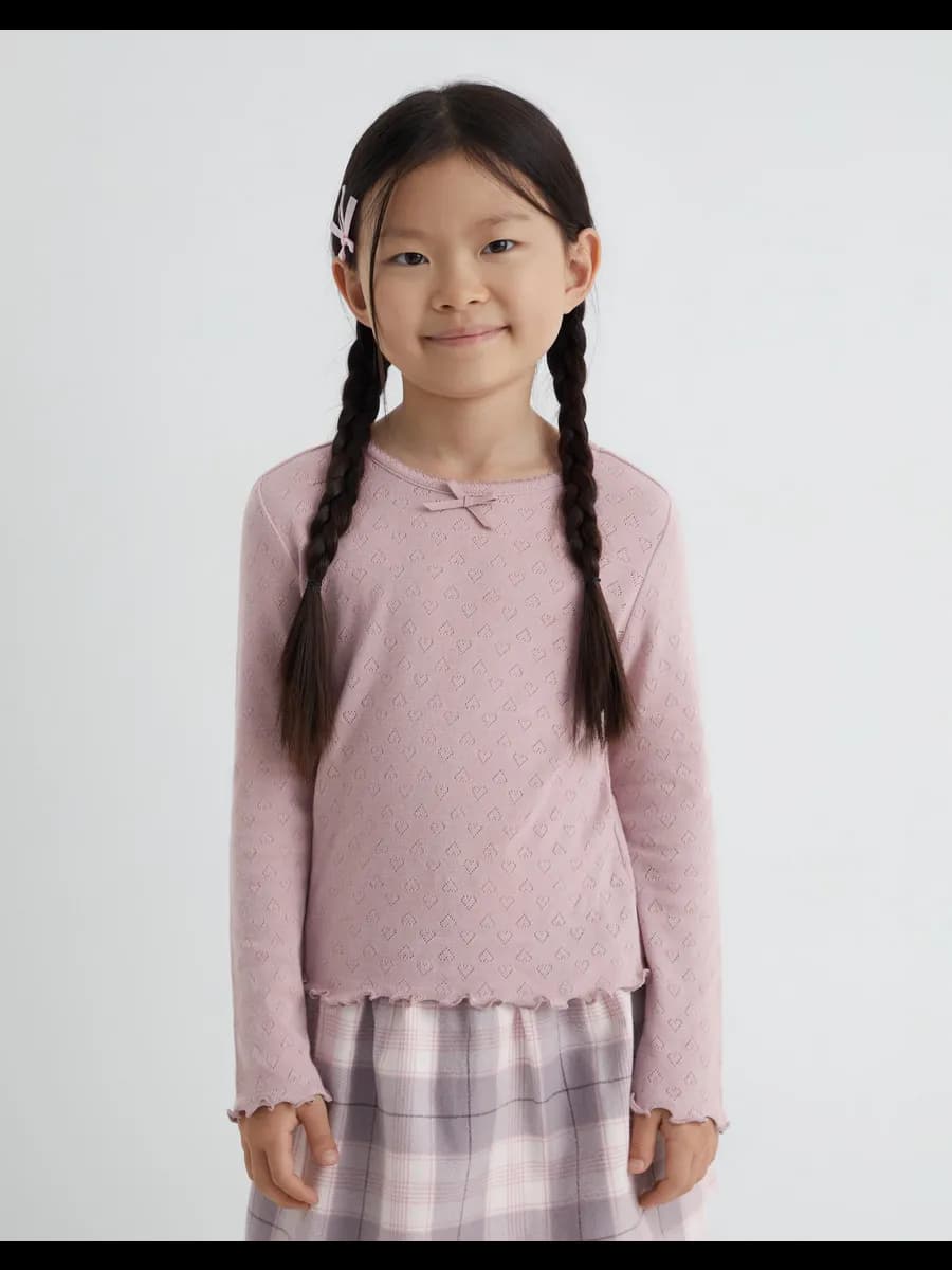 Пыльно-розовый лонгслив с волнистым краем и бантиком