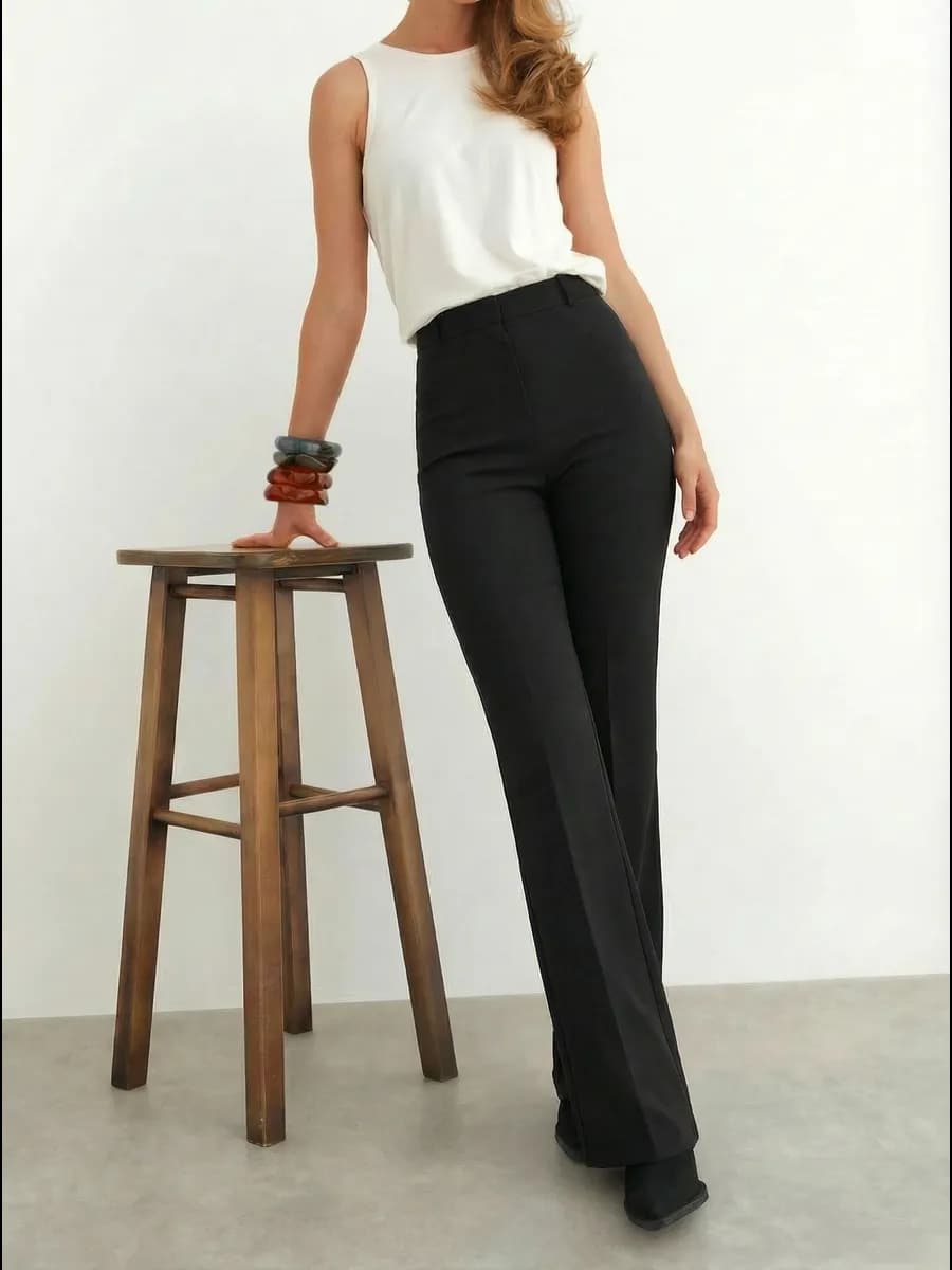 Брюки клеш классические облегающие от колена